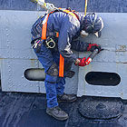 Using needle scaler to restore USS Pampanito