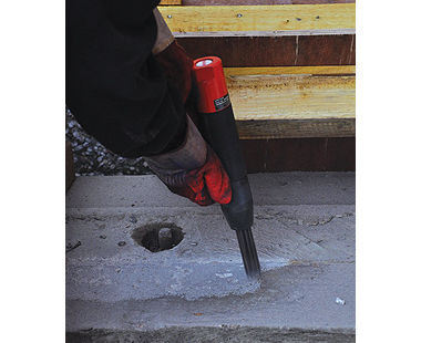 Needle scaler removing concrete