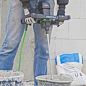 Hand-held mixing drill for concrete and masonry