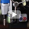 Portable magnetic drill with automatic feed into and out of the hole