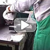 Portable band saw cutting stainless steel