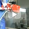 Pneumatic concrete chain saw for straight and plunge cuts